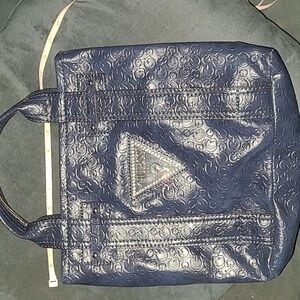 Guess handbag , brand emblem , shiny navy blue, dbl. handle,”G” pattern